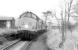 37682 and a sister locomotive wait with a stone train for the level crossing gates to be opened at Rylstone on the former Grassington branch, on 22 November 1991.<br><br>[Bill Roberton 22/11/1991]