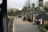 Unchanged since Jenny Agutter's tearjerker scene in <I>The Railway Children</I> Oakworth is a period gem and lovingly maintained by KWVR members. Seen here from an approaching Oxenhope bound train the station has become so familiar over the years that you half expect it to be Bernard Cribbins opening the gates. <br><br>[Mark Bartlett 07/01/2012]