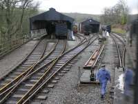 A different view of Oxenhope station, and the KWVR carriage sheds, from the footplate of 4F 0-6-0 43924 which was running round the stock in the station platform. The single line token in the fireman's hand is also the key for the points and D2511, which can be seen lurking alongside the shed, is locked in to the yard until that token is surrendered, in this case at Damens loop signalbox.<br><br>[Mark Bartlett 07/01/2012]