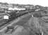 A long mixed freight approaches Healey Mills Yard behind 40007 in May 1977. When this photograph was taken there were still four tracks between Wakefield Kirkgate and Healey Mills (and indeed further west as far as Heaton Lodge) still justified by the number of train movements along this section.<br><br>[Bill Jamieson /05/1977]