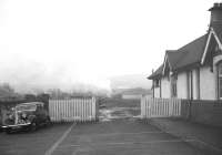 View from the station forecourt at West Kilbride in February 1963 as a northbound train leaves the platform.<br><br>[R Sillitto/A Renfrew Collection (Courtesy Bruce McCartney) 25/02/1963]