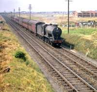 A train approaching Saughton Junction from the north, Edinburgh bound, on 29 July 1959. Locomotive is St Margarets J39 0-6-0 no 64795. <br><br>[A Snapper (Courtesy Bruce McCartney) 29/07/1959]