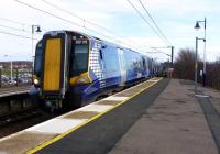 The 14.43 Ayr - Glasgow Central service arrives at the platform at Troon on 17 March.<br><br>[Colin Miller 17/03/2012]