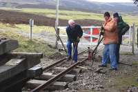 Permanent way maintenance taking place at the west end of the Leadhills station on 15 March 2012.<br><br>[Bill Roberton 15/03/2012]