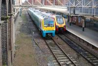A Virgin Voyager waits at the east end of platform 3 at Chester station on 21 March 2012 as an Arriva Trains Wales Class 175 passes on the centre road to gain access to the west end of the platform. <br><br>[John McIntyre 21/03/2012]