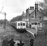 Class 101 power car No. E51437 is the centre of attention for a small band of enthusiasts who have just travelled on the early afternoon service from Haltwhistle on 27th March 1976. <br><br>[Bill Jamieson 27/03/1976]