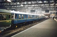 One of the new 'soon to be introduced' <I>Blue Trains</I> being displayed as part of the Scottish Industries Exhibition at platform 5 of Glasgow Central station on 5 September 1959. Also on display alongside the 3-car train is recently delivered Whickham railbus no SC 79969 [see image 26800].<br><br>[A Snapper (Courtesy Bruce McCartney) 05/09/1959]