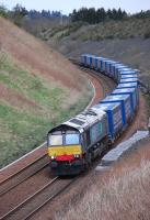DRS 66430 coasts downhill to the south of Gleneagles on 12 April with the 4D47 Inverness - Mossend intermodal, composed entirely of Tesco containers.<br>
 <br>
<br>
 <br><br>[Bill Roberton 12/04/2012]