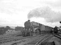 <I>'Not today thanks...'</I> seems to be the message from the driver of Black 5 no 45124 in July 1962 as he takes an express freight past a waiting banking locomotive at Beattock South and continues the journey north unabated.<br><br>[R Sillitto/A Renfrew Collection (Courtesy Bruce McCartney) /07/1962]