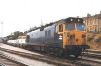 Class 50 no 50009 <I>'Conqueror'</I> stands at Laira in 1979 with a train of clayhoods.<br><br>[Ian Dinmore //1979]