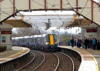 An Ayr - Glasgow Central service approaching the northbound platform at Troon on 25 April 2012.<br><br>[John Steven 25/04/2012]