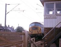 A re-engined NBL Type 2 Bo-Bo locomotive passes Cardross signal box with a West Highland Line service heading for Glasgow Queen Street in May 1968 under the watchful eye of the signalman.<br><br>[John McIntyre /05/1968]