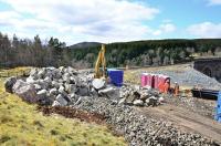 Large boulders piled up at the south end of Slochd Viaduct on 28 April 2012. These were ready to be used as infill at the site of the landslip that had led to closure of the main line [see recent news items].<br><br>[John Gray 28/04/2012]