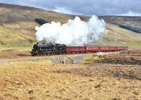 A break in the clouds allows the sun to shine on Black 5 No 45305 as it nears Luib Summit with the <I>Great Britain V</I> on 23 April. (The locomotive is missing the GB V headboard.)<br><br>[John Gray 23/04/2012]