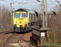 Freightliner 66561 on the approach to Troon with coal hoppers on 25 April 2012.<br><br>[John Steven 25/04/2012]