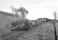BR Standard class 4 2-6-4T no 80000 on Tarbet Hill, West Kilbride, in May 1963 with an Ardeer workers train.<br><br>[R Sillitto/A Renfrew Collection (Courtesy Bruce McCartney) 09/05/1963]