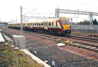 A Milngavie train about to run into platform 2 at Bathgate on 17 April 2012. The ScotRail stabling/cleaning roads can be seen in the background.<br><br>[John Furnevel 17/04/2012]