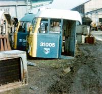 <I>'Somebody call me a cab...'</I>  Remains of 31005 (D5505) in the cutting-up area at Doncaster Works in February 1981. Part of sister locomotive 31003 (D5503) is in the background. Both are recorded as having been withdrawn from Stratford shed a year earlier. <br><br>[Colin Alexander /02/1981]