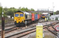 Freightliner 66540 gets the road east through Didcot on 17 May 2012 with a load of containers from Wentloog, Cardiff, heading for Southampton. <br>
<br><br>[Peter Todd 17/05/2012]