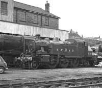 Ivatt 2MT tank No. 41241 in a version of LMS red with the Keighley and Worth Valley initials on its tank sides stands in Haworth Yard on Sunday 28 March 1976.<br><br>[Bill Jamieson 28/03/1976]