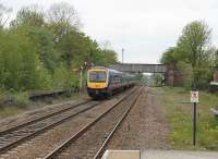 Gilberdyke station sees two Trans-Pennine 170 units heading west from Hull to Manchester Airport with a Sunday evening service. The semaphore signal indicates they are taking the Selby and Leeds route rather than the Goole and Doncaster line. <br><br>[Mark Bartlett 20/05/2012]