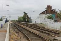 Eastrington, now an unstaffed halt on the Gilberdyke to Selby line, seen here in May 2012 with a view from the level crossing east towards Gilberdyke and Hull. <br><br>[Mark Bartlett 20/05/2012]