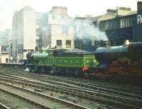 Having brought a 'Scottish Industries Exhibition' special into Glasgow Central on 5 September 1959, locomotives No 49 <I>Gordon Highlander</I> + GWR No 3440 <I>City of Truro</I> reverse out of the station on their way to Polmadie shed.<br><br>[A Snapper (Courtesy Bruce McCartney) 05/09/1959]