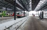 Two double-deck sets side by side at Helsinki on 22 February 2012. The nearer one is in the process of being propelled out of the station.<br><br>[Colin Miller 22/02/2012]