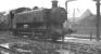 Hawksworth 0-6-0PT no 8467 stands in a wet Llanelli shed yard on 4 October 1961. The locomotive was withdrawn by BR the following February, while the shed itself, coded 87F, was officially closed in October 1965.<br><br>[K A Gray 04/10/1961]