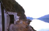 The avalanche shelter alongside a placid Loch Carron, looking back towards Strome Ferry in Summer 1974.<br><br>[David Spaven //1974]