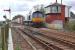 DRS 66305 passes Errol signalbox with the 4A13 Grangemouth - Aberdeen intermodal service in April 2012.<br><br>[Bill Roberton 12/04/2012]