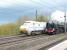 Old meets new at Durham on Saturday 21 April 2012. Britannia Pacific 70013 <I>Oliver Cromwell</I> photographed heading north on the York - Edinburgh leg of the <I>'Great Britain V'</I> railtour passing an up ECML service. Part of Durham Cathedral can just be seen in the left background.<br><br>[Jim Peebles 21/04/2012]