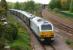 67026 on the rear of the Royal Train conveying HRH Prince Charles from an earlier engagement in Burnley on 16 May 2012. The train is seen heading from Lostock Hall Jct to Farington Jct before joining the WCML to head south. In the right background is Lostock Hall station on the line to Farington Curve Jct and Preston.<br><br>[John McIntyre 16/05/2012]