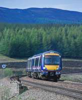A southbound service heads round the curve south of Dalwhinnie station.<br><br>[Ewan Crawford 22/05/2012]