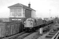 40135 draws its train of empty cartics past Bathgate Central signal box in December 1983. No track survived on the other side of the signalbox by this time. [See image 39045]<br><br>[Bill Roberton 08/12/1983]