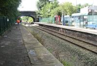 View along the disused but now tidied-up platform at Burscough Jct on 21 August 2010. The view is from slightly further north than the photograph 24 years earlier [see image 38989]. Class 142s are often still seen on the Preston - Ormskirk shuttle, however on the day in question I was much too involved in my work to photograph passing trains! [Editor's note: Alongside Burscough Junction station stands a well known local hostelry named 'The Junction Hotel.']<br><br>[John McIntyre 21/08/2010]