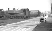 Part of the works yard at Horwich in September 1960, featuring Aspinall ex-LYR Class 23 no 11305, one of the departmental 0-6-0ST works locomotives. [See image 36059]<br><br>[K A Gray 25/09/1960]