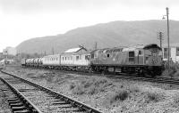 26032 standing in the down siding at Aviemore at the head of a weedkiller train in June 1978, with the Strathspey Railway main line in the foreground.<br><br>[Bill Roberton 01/06/1978]