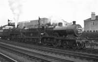 Hurlford based 2P 4-4-0 No. 40687 gives Standard Class 5 4-6-0 No. 73045 of Holbeck shed some assistance for the climb to Polquhap summit with the up <I>'Thames Clyde Express'</I> in August 1959, seen here prior to departing from Kilmarnock. <br><br>[Bill Jamieson /08/1959]