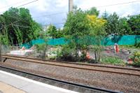 Some works for the new footbridge and surveying for the new additional eastbound platform at Hyndland station. View at west end of station looking north.<br><br>[Ewan Crawford 12/06/2012]