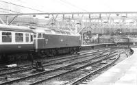 One of the Stratford 'Silverback' class 47s no 47115 waits to take out the 09.30 to Norwich from Liverpool Street in February 1983 as a class 37 arrives in the background with a train from Kings Lynn.<br><br>[John Furnevel 04/02/1983]