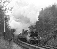 <I>Flying Scotsman</I> bursts out of Melling Tunnel and passes Wennington up distant while working the GMRS special of 24th April 1976 on its return from Carnforth to York.<br><br>[Bill Jamieson 24/04/1976]