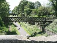 A young girl and her dog passing through the remains of Eskbank station on a bright and sunny afternoon. View south from the road bridge on 18 June 2012.<br><br>[John Furnevel 18/06/2012]