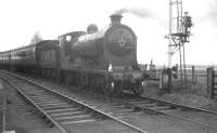 Ex-NBR no 256 <I>Glen Douglas</I> with <I>Scottish Rambler No 3</I> on the level crossing at Kincardine station on 30 March 1964 during the leg from Dunfermline to Alloa. [See image 6479]<br><br>[K A Gray 30/03/1964]