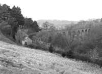Lambley station and viaduct viewed from the south west in March 1976. Looking at the sylvan surroundings, it is difficult to imagine that there was once a coalfield immediately to the west of here, served by Lord Carlisle's Brampton Railway, which ran through from Brampton to Lambley.<br><br>[Bill Jamieson 27/03/1976]