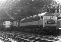 Brush type 4 no 1777 about to take a train out of Liverpool Street station in March 1970. In the background is one of the less than successful BTH Type 1 locomotives no D8234, put to work by Stratford shed that day as station pilot. This particular example was withdrawn the following March after ten and a half years operational service. <br><br>[John Furnevel 10/03/1970]