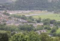 A six-car Class 170 set approaches Stirling from Perth with a Sunday afternoon service. Above the train the Alloa line can be seen curving away. This view taken from Stirling Castle. <br><br>[Mark Bartlett 01/07/2012]