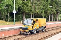 The operation to reopen the West Highland Line and recover GBRf 66734 [see image 39479] is being managed from Tulloch and this ro-rail vehicle is seen there on 4 July 2012 about to take more workers to the site.<br><br>[John Gray 04/07/2012]