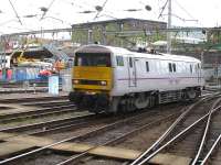 East Coast Trains 91112 runs back into platform 3 at King Cross on 13 June to attach to a Mk 4 rake and take over from 91124 which was in need of attention at Bounds Green depot. <br><br>[David Pesterfield 13/06/2012]