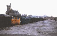 A gloomy day in late 1974 as 24103 prepares to take the daily freight to Aberdeen away from Fraserburgh.<br><br>[David Spaven //1974]